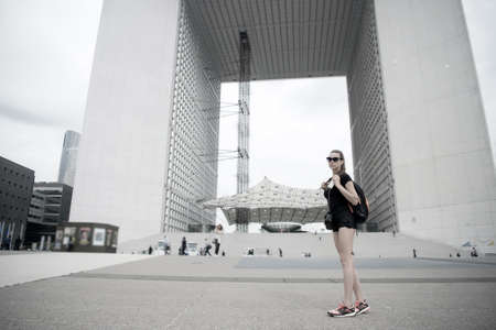Travel bag is her companion. Sexy woman travel in modern city. Leisure and pleasure travel....
