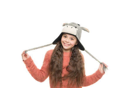 happy childhood activity. little girl in earflap hat funny pattern. winter holiday wonder. child...