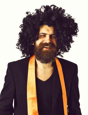 caucasian hipster in suit and black curly wig