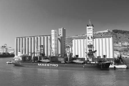 Barcelona, Spain - March 30, 2016: bulk ship Maestro with cranes in sea port. Bulk shipment....