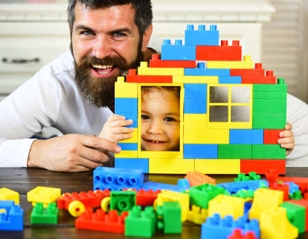 Boy and man on defocused background. Father and son