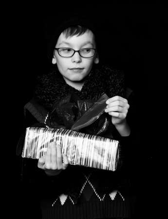 boy nerd with present boxの写真素材