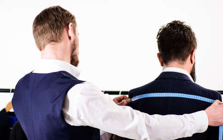 Tailor measure back for sewing suit, white background.
