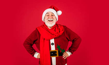 So pleased. shopping. Merry Christmas and Happy Holidays. New year is coming. happiness and joy. ready for xmas party. celebrate winter holiday. funny man wear santa claus coat and hatの写真素材