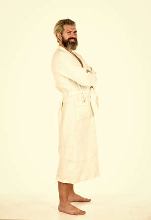handsome man in the morning. relaxed man in white terry bathrobe. Morning portrait of bearded man. rest and day off work. sick man spend day off at home. carefree guy relaxingの写真素材