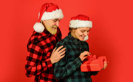 Man and woman christmas holiday celebration. Giving present. Love and care. Spread love. Making...