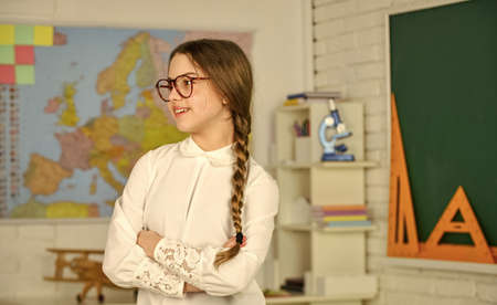 School girl hold at blackboard. Instrument of Measurement. different school elements. autumn school time. Back to school. education in college. study geography map. mired in geometry. knowledge dayの写真素材