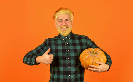 I love autumn. hipster with gourd. farmer harvesting in countryside. fall seasonal concept. Autumn harvest. Happy Thanksgiving day. Happy halloween. Healthy food growing. retro man hold pumpkinの写真素材