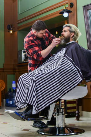 Say yes to new things. barber professional master. making new hairstyle. man get trendy haircut. fashionable hairdo for real men. beauty and fashion. dye hair and give shape. male hairdresser salonの写真素材
