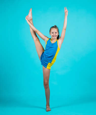 Sport success. child in sport clothes training. concept of stretching and warming up. childhood...
