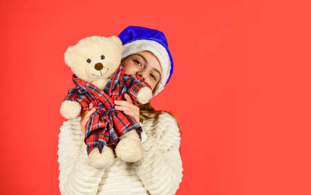 Small girl hold teddy bear toy. Kid little girl play toy teddy bear. Simple happiness. Happy childhood. Toys shop. Cute plush friend. Christmas gift. Teddy bear improve psychological well beingの写真素材