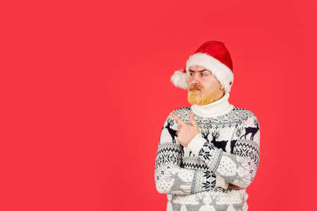 bearded hipster dyed hair red background. new year party is here. copy space. christmas shopping...