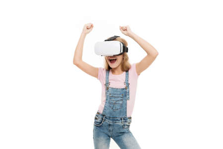 Enjoying new experience. The future of VR is here. Little girl wearing virtual reality headset....