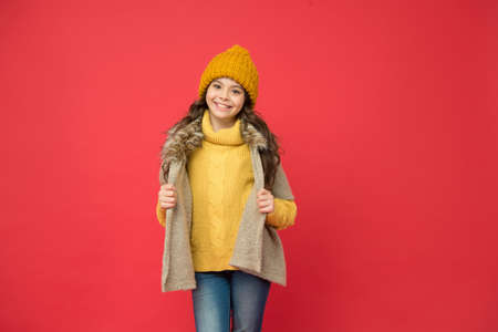happy teen girl in knitted sweater and hat wear warm clothes in winter season, fashion