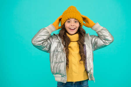 seasonal kid fashion. cozy and comfortable. childhood happiness. teen girl ready for winter. Lets celebrate. padded clothing style. care yourself in cold weather. happy child in warm winter clothesの写真素材