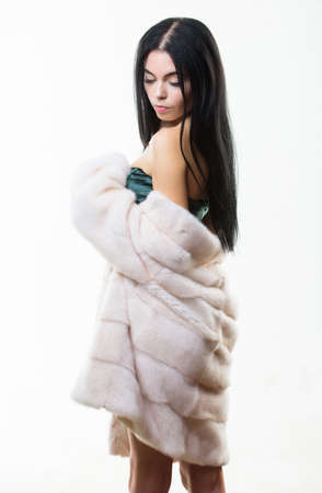 Girl elegant lady wear fashionable coat jacket. Luxurious fur. Female with makeup wear mink beige fur coat. Girl posing fur coat. Woman attractive nude shoulders wear short coat. Fashion conceptの写真素材