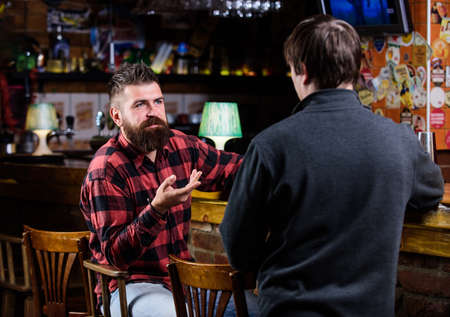 Men relaxing at bar. Friendship and leisure. Friday relaxation in bar. Friends relaxing in bar or...