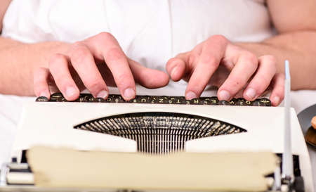 Vintage typewriter concept. Hands typing retro writing machine. Old typewriter and authors hands....