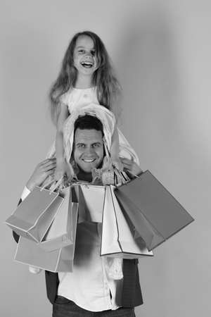 Schoolgirl and father do shopping and have fun. Shopping, presentsの写真素材