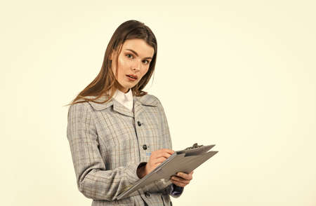 Brand new stylish suit. serious woman work with documents. successful office worker. fashion beauty look. casual fashion style. brunette woman with trendy makeup. sexy girl in jacket hold folderの写真素材
