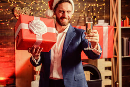 Tradition giving gifts. Businessman excited face hold gift box. Secret santa office tradition. Celebrate christmas corporate party. Man formal suit hold gift box. Christmas gift from colleagueの写真素材
