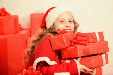 Dreams come true. Winter happiness concept. Explore christmas gifts. Unpacking christmas gift. Kid excited about christmas present. Winter miracle. Girl celebrate christmas. Santa bring her giftの写真素材
