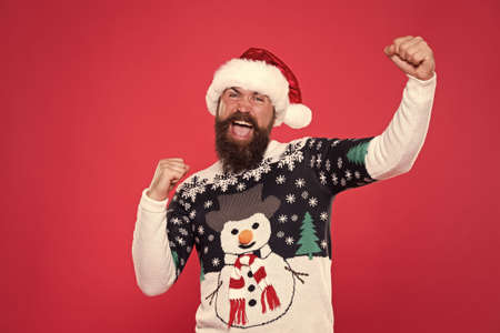 Holiday atmosphere. ready for new year. merry christmas. happy bearded man red santa hat. cheerful...