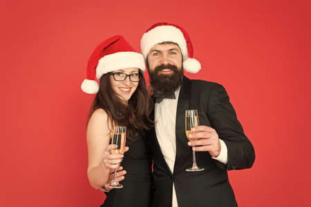 Happy new year. Bearded gentleman wear tuxedo girl elegant dress. Merry christmas. Office party. Visiting event party ceremony. Couple ready corporate party. Official celebration. Greetings conceptの写真素材