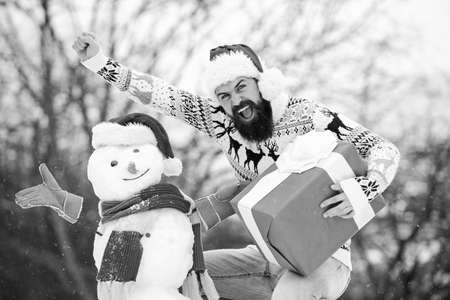 Feeling playful. bearded man build snowman. winter season activity. Merry christmas. santa man give...