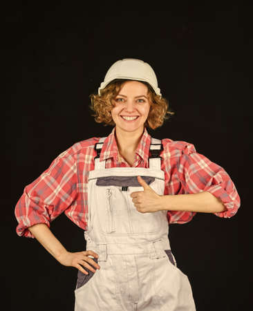 Lady at construction site. Warehouse woman worker. Quality inspector. Construction job occupation. Construction worker. Woman builder in hardhat. Girl engineer or architect. Home renovationの写真素材