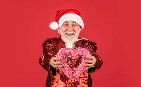 I cant believe in it. funny man wear santa claus coat and hat. shopping. Merry Christmas and Happy Holidays. New year is coming. happiness and joy. ready for xmas party. celebrate winter holidayの写真素材