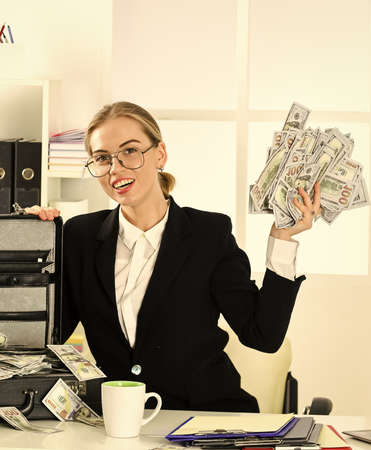 her achievement. confident millionaire. economy and finance. rich bank worker. investment in yourself. businesswoman with office bag. successful woman got lot of money. she make dollarsの写真素材