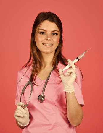 woman doctor use syringe. happy nurse make injection. health worker dials vaccine in syringe. Physician or therapist giving vaccine against virus. coronavirus epidemic from china.の写真素材