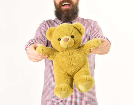 Gifts and holidays concept. Man holds soft toy in handの写真素材