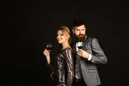 Man with beard, woman in dress celebrateの写真素材