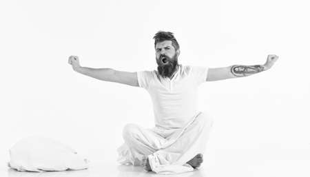 Man with sleepy, yawning face stretching, wake up.の写真素材