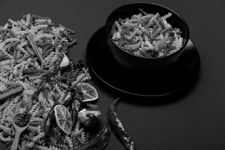 different ingredients for cooking and delicious italian pasta in plateの写真素材