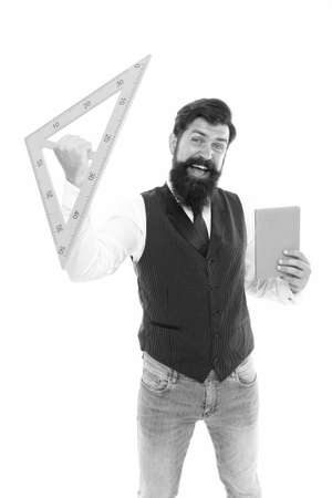 Provider of education. Expand skills and knowledge. Measurement tool. Teacher bearded man. Teaching geometry. Bearded man use ruler. School lesson. Teaching with fun. Back to school. School classesの写真素材