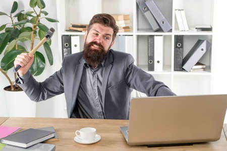 full of rage. frustrated computer user. businessman express anger. ready to smash. Office life makes...