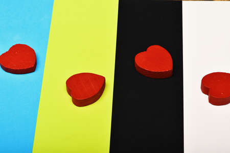 Love and relationship concept: red hearts on colourful background