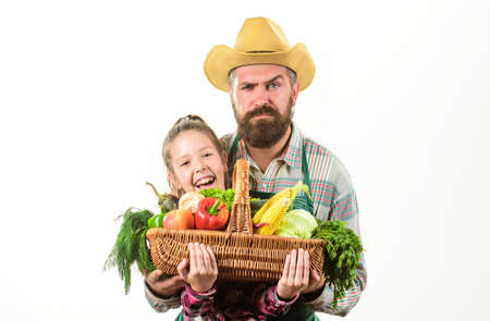 Farmer family homegrown harvest. Father and daughter hold basket harvest vegetables. My father is...