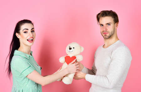 Valentines day and love. Handsome man and pretty girl in love. Man and woman couple in love hold...