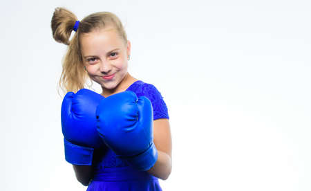 Sport and health concept. Boxing sport for female. Girl child with blue gloves posing on white...