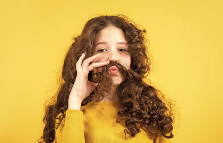 Professional cosmetics. Freedom self expression. Girl hairdresser salon. Enjoying shiny curls....