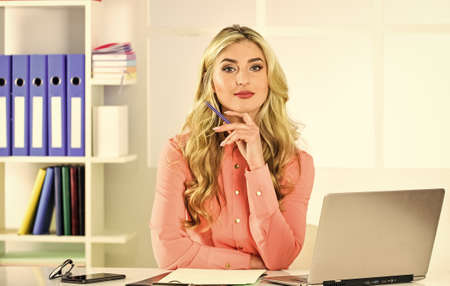 Online database. Pretty woman working office interior background. Insurance agent ready to help. Find affordable insurance coverage. Keep studying. Build business. Independent insurance agentの写真素材