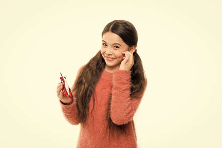 Only fun on my mind. Christmas holiday. Eyeglasses for Santa Claus. Christmas celebration. Girl cute child play photo booth props. Child hold christmas party accessory. Cheerful mood. Winter styleの写真素材