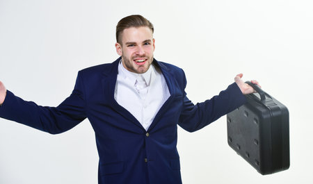 Business conference. Business attributes. Justification for proposed project or expected commercial benefit. Man hold briefcase. Business profit. Commercial offer. Businessman demonstrate briefcaseの写真素材