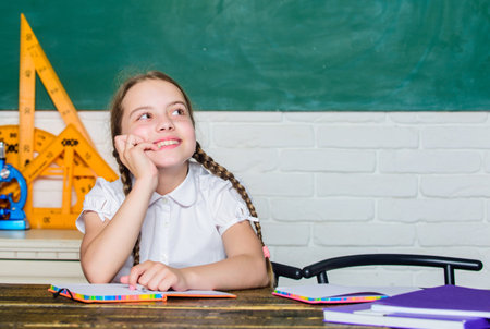 happy dreamer. back to school. future success is studying. digital age with modern technology. small girl study with in school. Formal informal and nonformal education. small child in classroomの写真素材