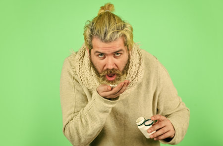 Medical prescription. Painkillers pills. Headache treatment. Mature man taking pills. Natural and...