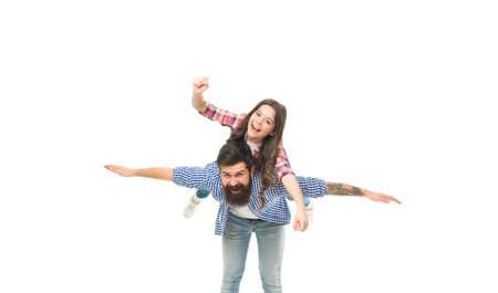 Just play, enjoy flight. Small child and bearded man playing pilots. Happy family enjoy playing together. Photo studio. Playing airplane game. Air travel. Playtime and leisure. Playing and having funの写真素材